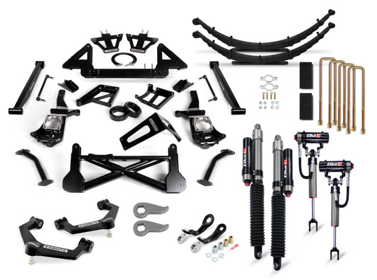 Assorted black and silver car suspension components, including the Cognito 12-Inch Elite Lift Kit with Elka 2.5 Reservoir Shocks for 2011-2019 Silverado/Sierra 2500/3500 trucks, are laid out on a white background. The set from Cognito Motorsports features leaf springs, shock absorbers, U-bolts, control arms, brackets, and other essential items for vehicle suspension assembly.