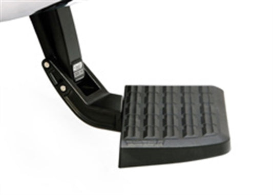 A close-up view of the AMP Research 2011-2014 GMC Sierra 2500/3500 BedStep in black, featuring a textured surface and attached to a metal bracket.
