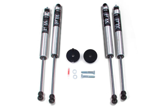 Image of four silver shock absorbers with "FOX" branding, a 1-inch coil spacer leveling kit labeled "BDS," two black mounting brackets, two bolts, two washers, and a small tube of red lubricant. The components are neatly arranged on a white background. Perfect for Ford F250 and F350 Super Duty upgrades between 2017-2019 models.