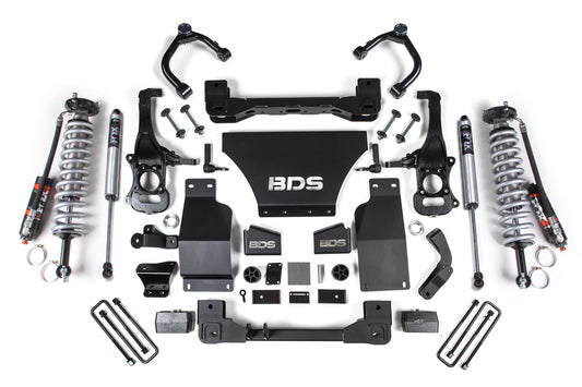 A selection of vehicle suspension system components, such as shock absorbers, brackets, and various hardware pieces, is displayed on a white background. The focal point showcases the "BDS" logo and is perfect for a Chevy Silverado or GMC Sierra 1500 (2019-2023) 4WD with a 4 Inch Lift Kit featuring FOX 2.5 Performance Elite Coil-Over shocks to boost off-road protection.