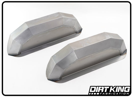 The image depicts two CAD-designed, metallic, trapezoidal-shaped objects with flat, angled surfaces and sharp edges, positioned next to each other on a white background. The logo "DIRT KING" is visible in the bottom right corner. These objects are identified as 99-18 GM 1500 Over-sized Rear Wheel Wells.