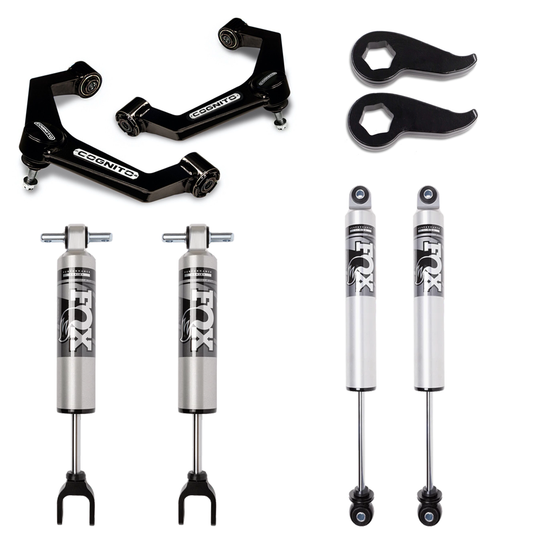The image showcases the LTW Motorsports 11-19 GM 2500/3500 Cognito Stage 2 Mid Travel Kit, featuring FOX 2.5 HTO Shocks, two COGNITO upper control arms, and black spanner wrenches for optimal suspension travel.